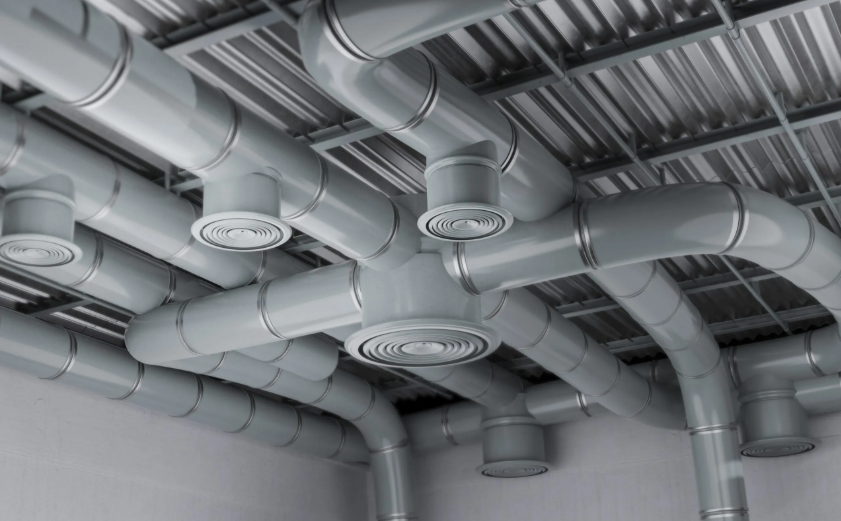 Overhead network of spiral air ducts and ventilation piping
